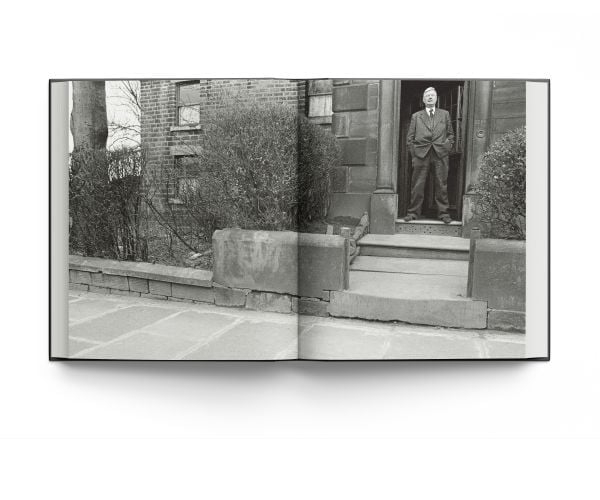 Book cover of Lowry: At Home, featuring the artist in his later years. Published by ACC Art Books.
