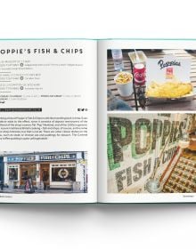 Book cover of Eat London: The 85 Tastiest Addresses, with a waiter lifting up domed lid of silver tray, revealing famous London landmarks. Published by ACC Art Books.