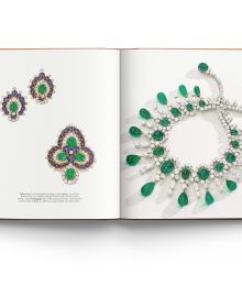 Book cover of Bulgari Treasures of Rome, featuring two halves of sapphire and emerald gemstones encrusted jewelry. Published by ACC Art Books.