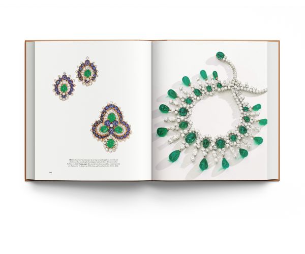 Book cover of Bulgari Treasures of Rome, featuring two halves of sapphire and emerald gemstones encrusted jewelry. Published by ACC Art Books.