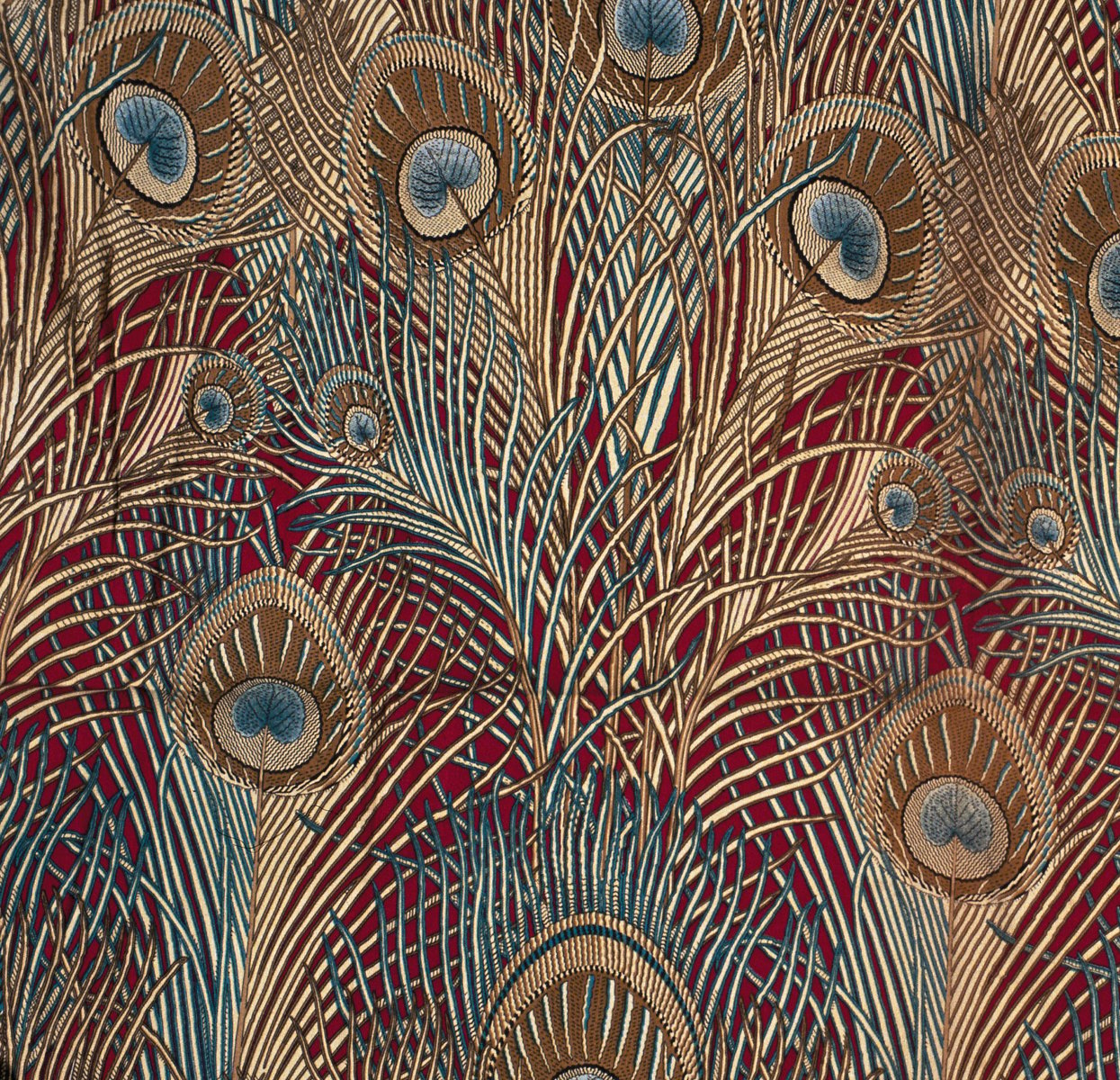 Luxury gold and blue peacock design fabric with Christopher Dresser Textiles Harry Lyons in white font below