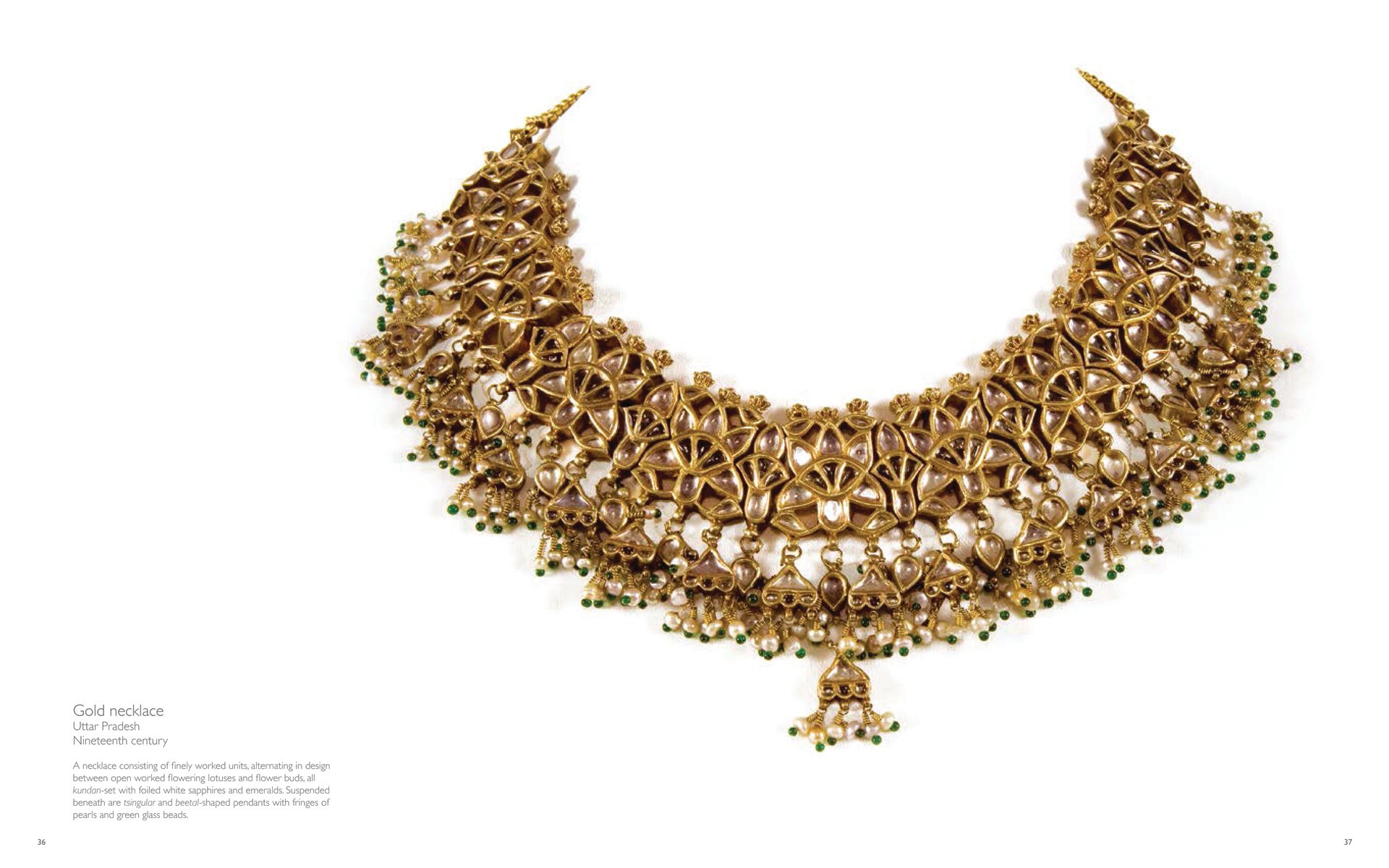 Photograph of a traditional Indian gold necklace decorated with gems and beads hanging on a white background with gold font title Traditional Indian Jewellery The Golden Smile of India underneath.