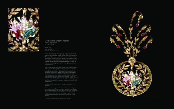 Pendant in the style of single flower on stem with a carved cabochon ruby in centre, on white cover of 'Traditional Indian Jewellery', by ACC Art Books.