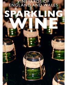 Tops of green glass corked wine bottles, on cover of 'Vineyards of England and Wales Sparkling Wine', by ACC Art Books.