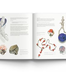 Small diamond encrusted jewellery piece with three larger gemstones, on cover of '21st-Century Jewellery Designers An Inspired Style', by ACC Art Books.