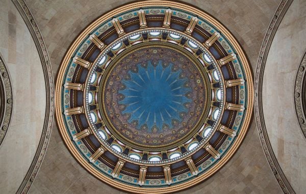 Book cover of An American Renaissance: Beaux-Arts Architecture in New York City, with low angled shot of interior ceiling dome with white and gold plaster. Published by Images Publishing.