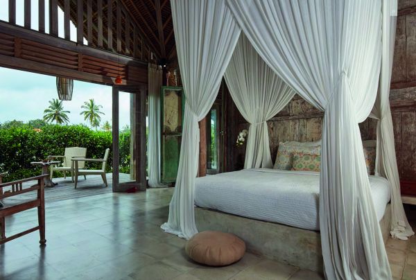 Book cover of Seen | Unseen: Embracing Natural Home Design in Bali, featuring a Balinese villa with thatched roof. Publishing by Images Publishing.