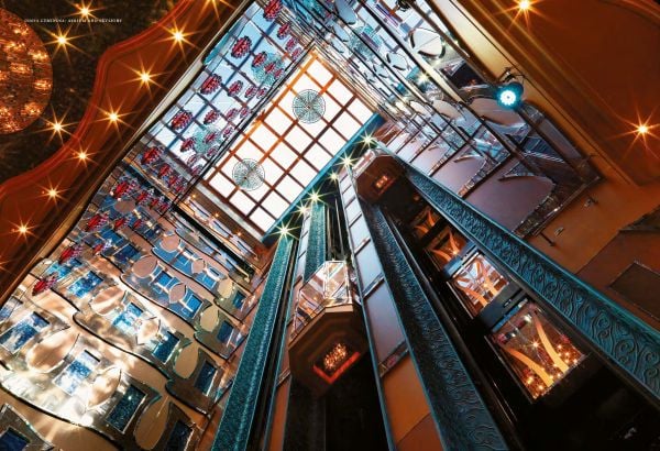 Book cover of Design on the High Seas: Setting the Scene for Entertainment Architecture Aboard Cruise Ships, featuring a grand theatre interior with stage area. Published by Images Publishing.