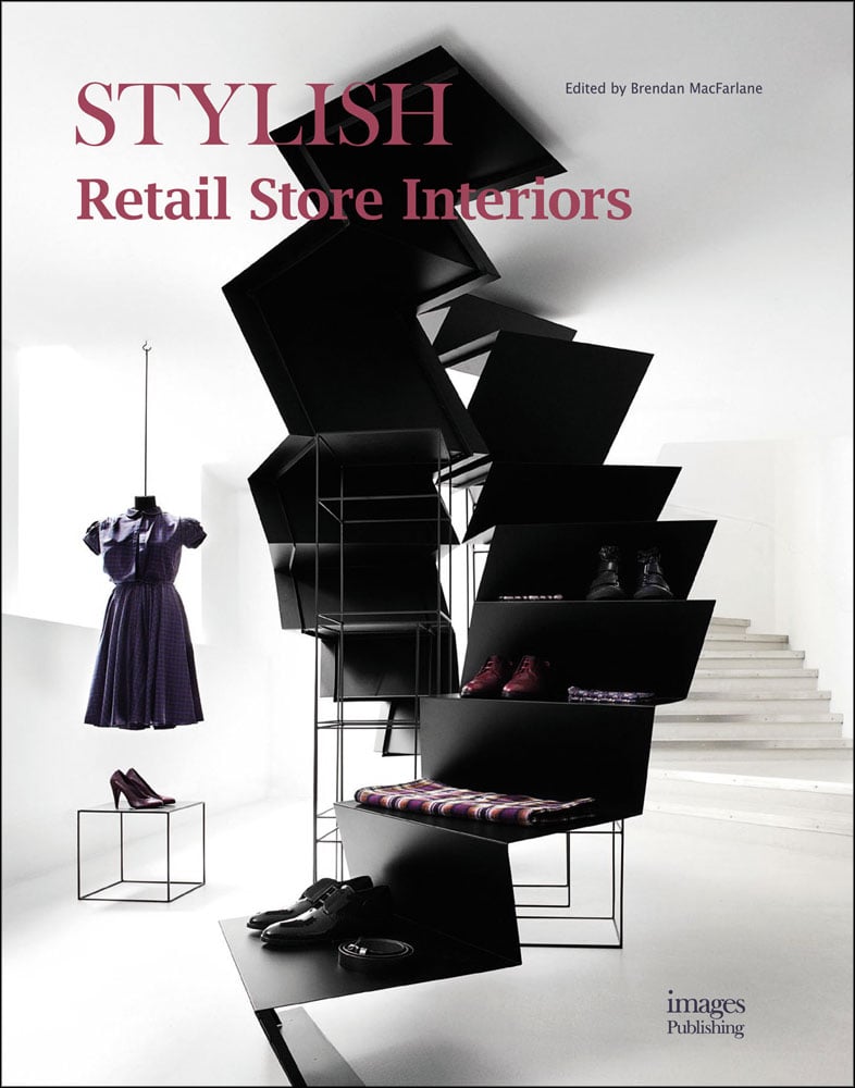 Black stepped product shelving with shoes and scarves, dress on hanger, Stylish Retail Store Interiors in rose font to top left