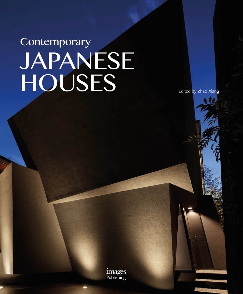 Angular modern building illuminated at night under blue sky, Contemporary Japanese Houses in white font to left