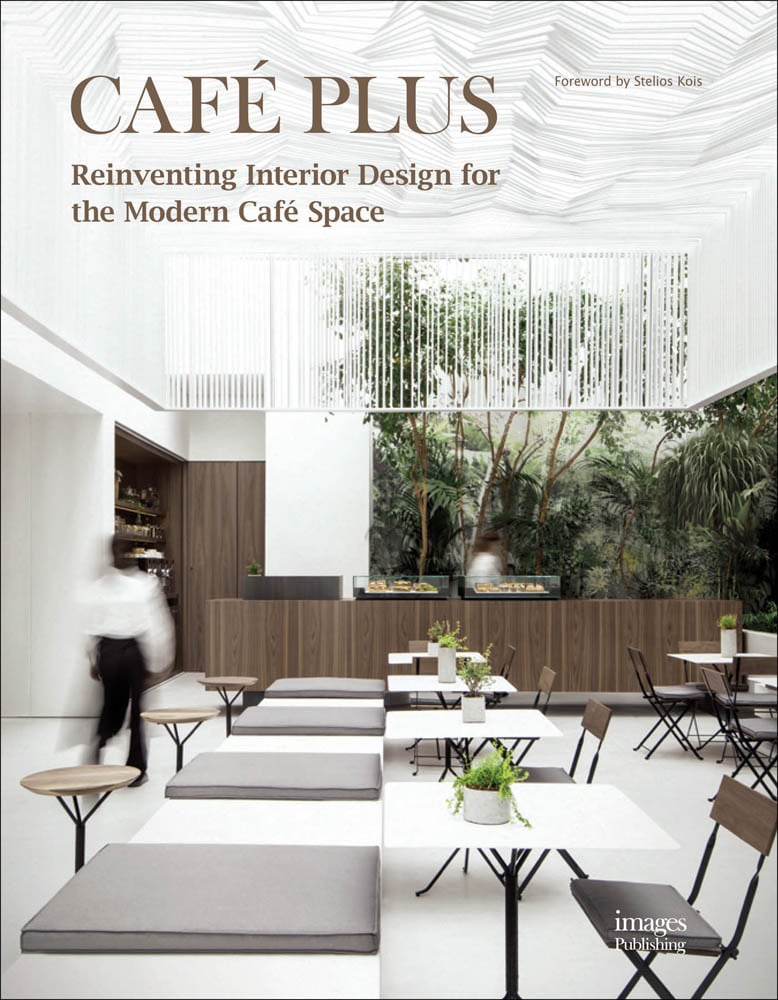 Modern interior café tables and chairs, green trees to backdrop, Café Plus in pale brown font above