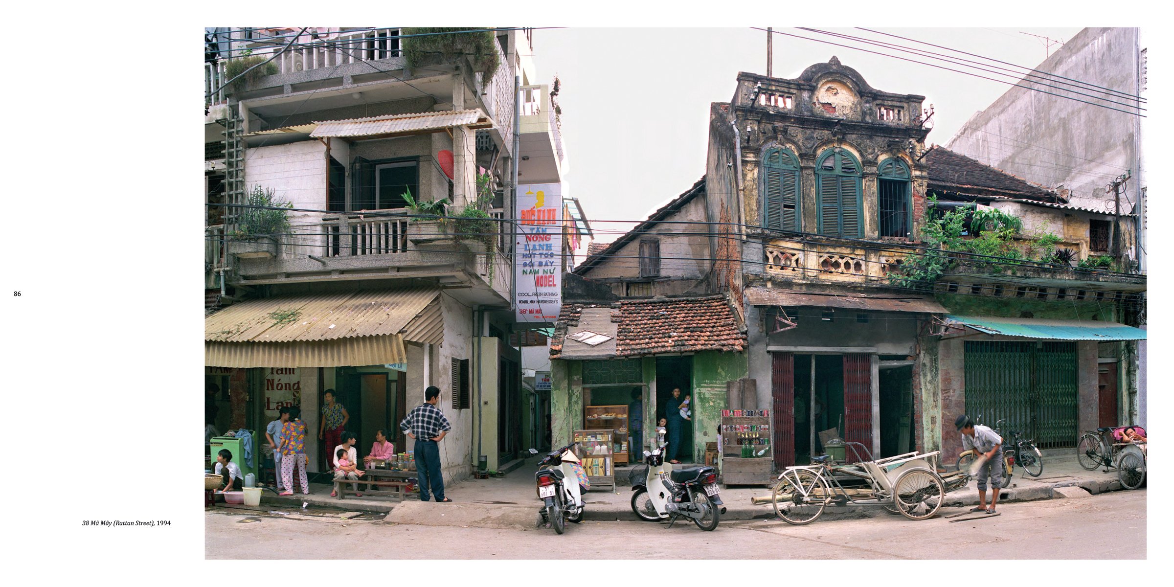 Book cover of Hanoi Streets 1985-2015: In the Years of Forgetting, with a push bike leaning against a shop in Vietnam. Published by Images Publishing.