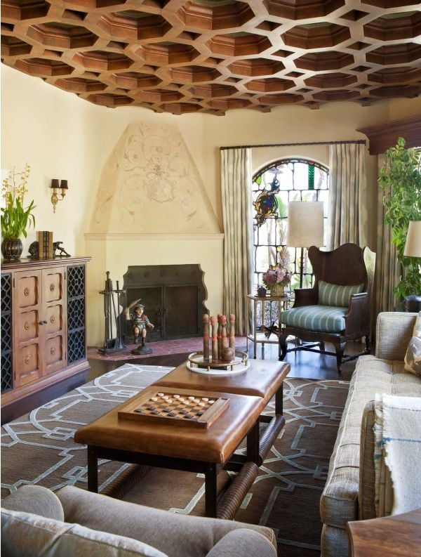 Book cover of Interiors Inside the American Home, feature a bright, open plan interior with pale furniture and large windows looking out onto cityscape, Published by Images Publishing.