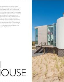 Book cover of The American House: 100 Contemporary Homes, featuring a a cabin at the bottom of the mountains. Published by Images Publishing.