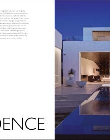 Book cover of The American House: 100 Contemporary Homes, featuring a a cabin at the bottom of the mountains. Published by Images Publishing.