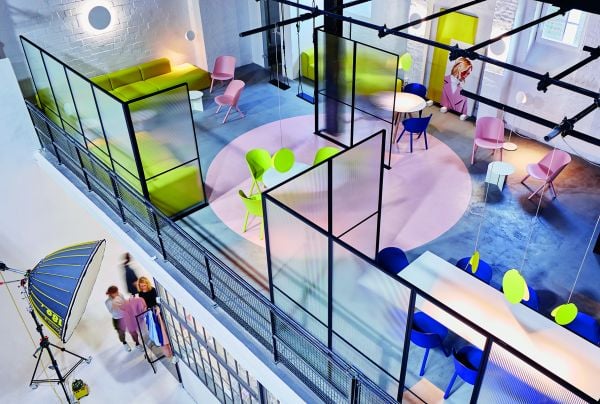 Book cover of Creative Spaces for Creative Ideas, with an artist sitting in wooden studio, with tree hammock in foreground. Published by Images Publishing.