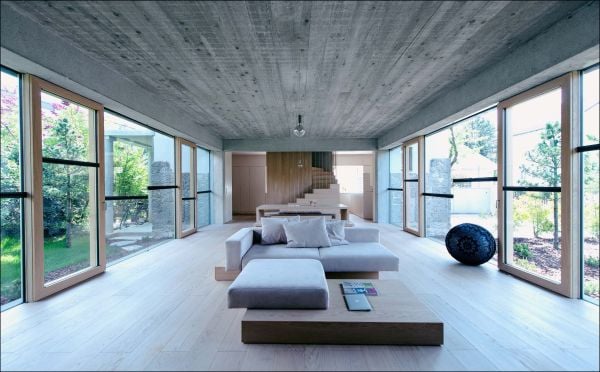 Book cover of Building Character: Transforming Old Homes for Modern Living, with a two story residential interior, with white dining table and chairs, and staircase leading to upper living space above. Published by Images Publishing.