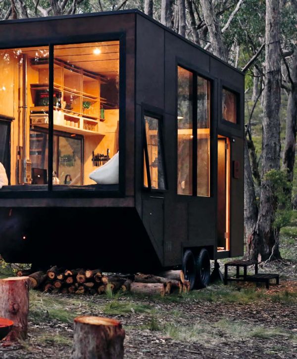 Book cover of Living Little: Simplicity and style in a small space, with an aerial view of figure lying on sofa. Published by Images Publishing.