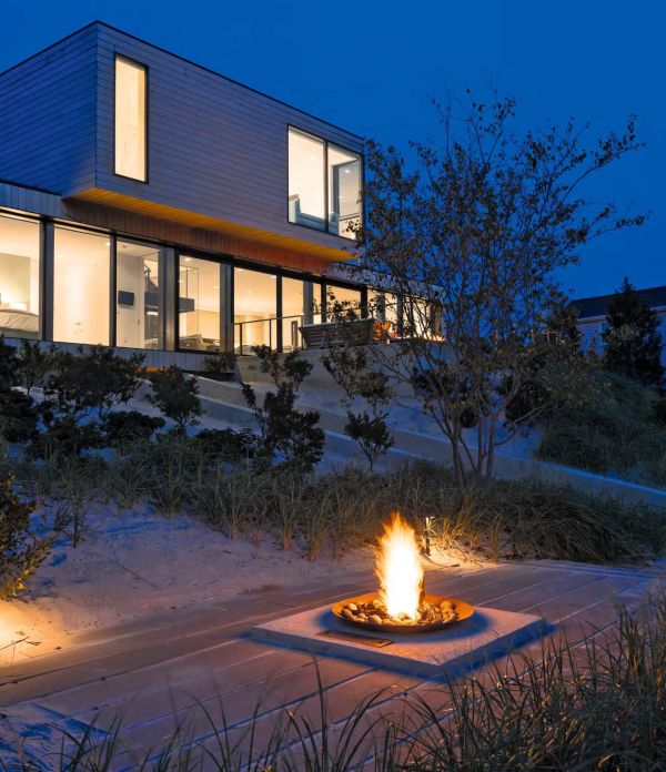Book cover of Beautiful Beach Houses: Living in Stunning Coastal Escapes, with a bright interior of beach house with sea view through windows. Published by Images Publishing.