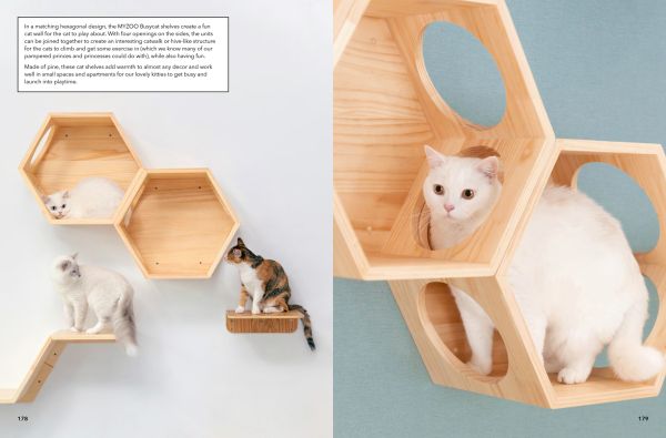 Fluffy white cat leaping out of clear dome doored bed inset in interior wall with For the Love of Pets in white font