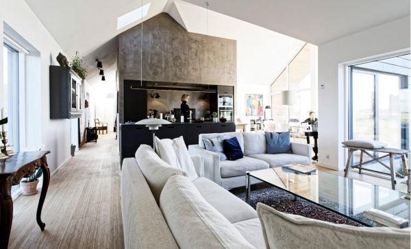 Book cover of Future Homes: Sustainable Innovative Designs, with a flat roof residential home with ornamental grasses. Published by Images Publishing.