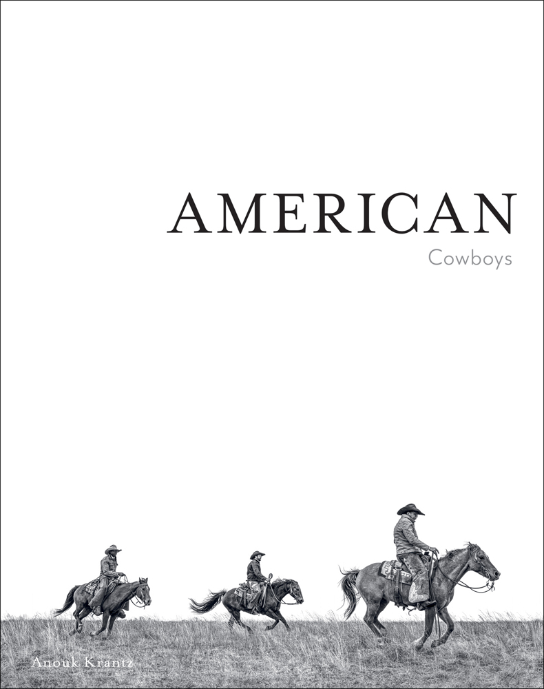 White cover with 3 cowboys on horseback riding across grassy landscape with American Cowboys in black and beige font