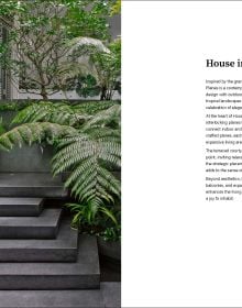 Book cover of The Homes That Shaped Us: People, Places, and Possibilities; featuring a dark interior with a chair and table below a skylight. Published by Images Publishing.