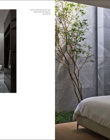 Book cover of The Homes That Shaped Us: People, Places, and Possibilities; featuring a dark interior with a chair and table below a skylight. Published by Images Publishing.