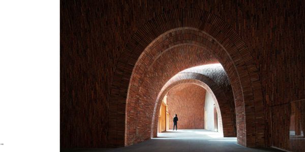 Book cover of Jingdezhen Imperial Kiln Museum, with interior wall and staircase of the museum, with a visitor walking down corridor. Published by Images Publishing.