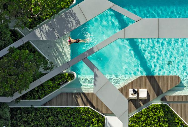 Book cover of TROP terrains + open space: Works 2007–2023, with the top of a building roof, with two spaces holding large trees. Published by Images Publishing.