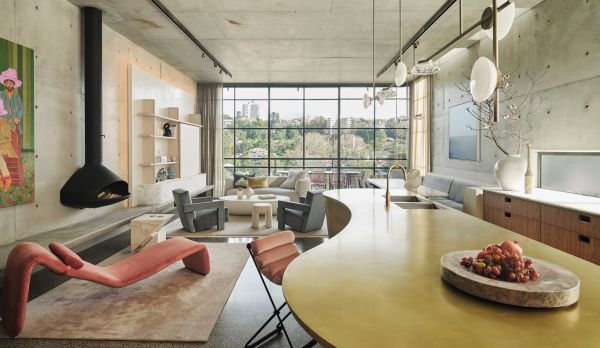 Book cover of Curated Living: Elegant Interiors and Artful Homes, featuring an interior living room with wood table and beige drapes. Published by Images Publishing.