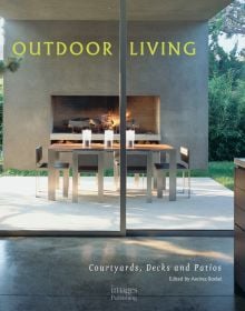 Book cover of Outdoor Living: Courtyards, Decks and Patios featuring a garden patio area with fireplace, table and chairs, and oven. Published by Images Publishing.