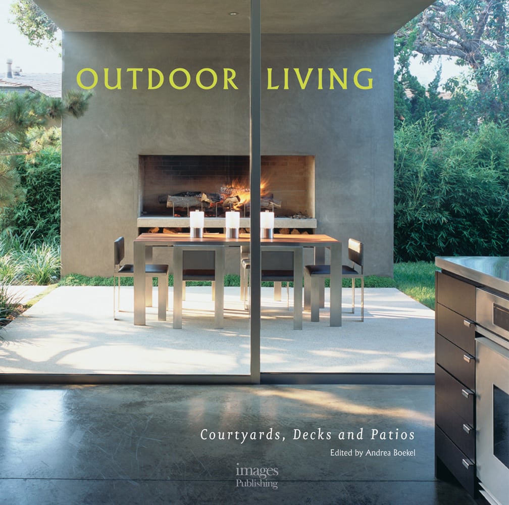 Book cover of Outdoor Living: Courtyards, Decks and Patios featuring a garden patio area with fireplace, table and chairs, and oven. Published by Images Publishing.