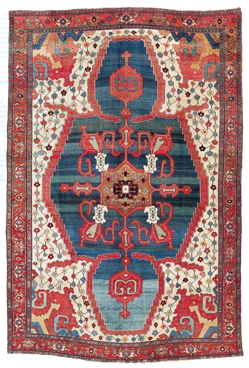 Book cover of The Persian Carpet Tradition, Six Centuries of Design Evolution, with a red and blue medallion design carpet design. Published by Hali Publications.