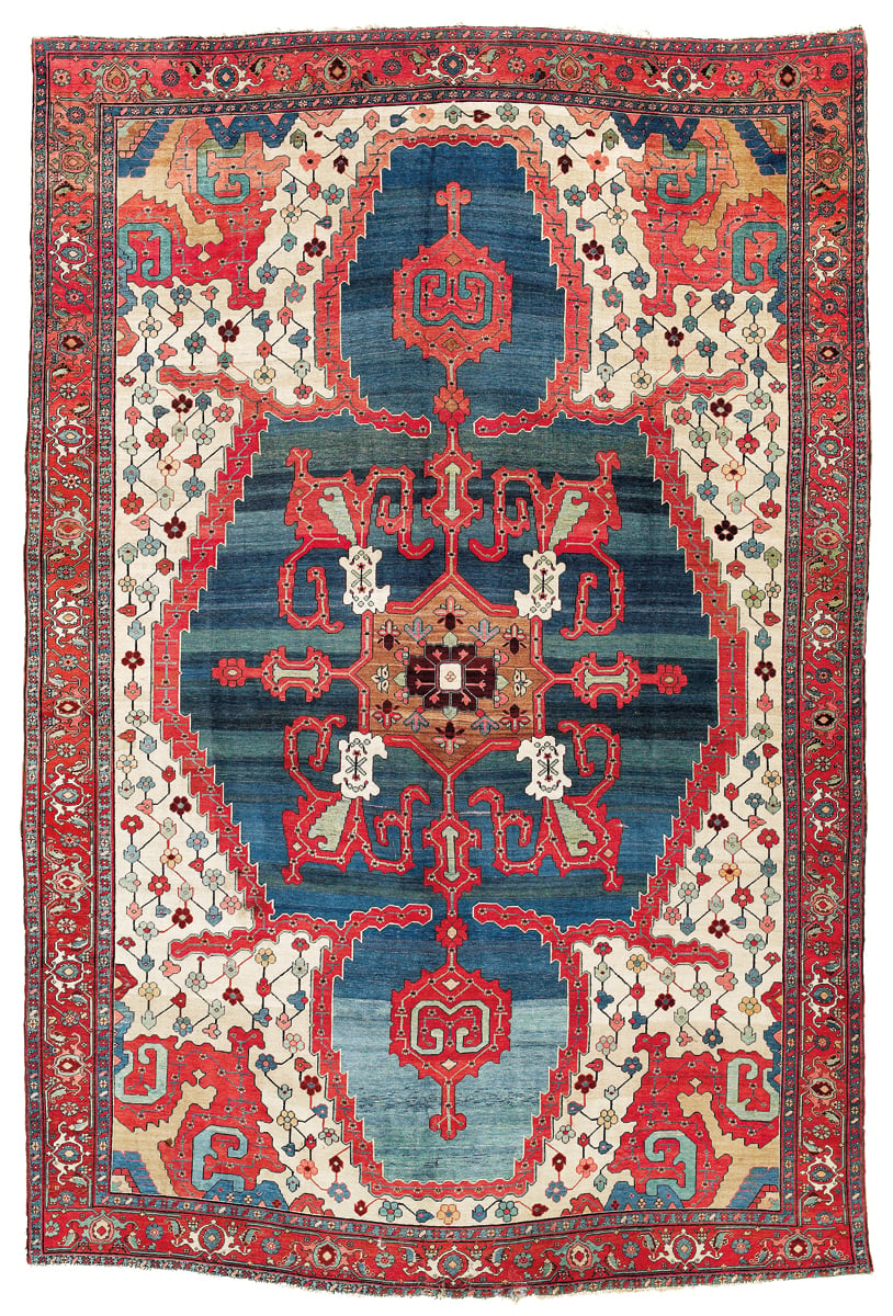 Red and blue medallion design carpet design, on cover of 'The Persian Carpet Tradition, Six Centuries of Design Evolution', by Hali Publications.