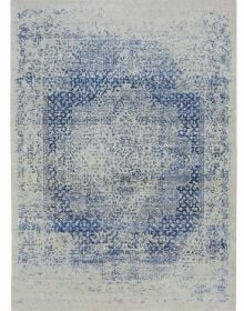 Montage of colourful pattered rugs, on white cover of 'The Handmade Carpet, A Comprehensive Guide to Contemporary Rugs', by Hali Publications.