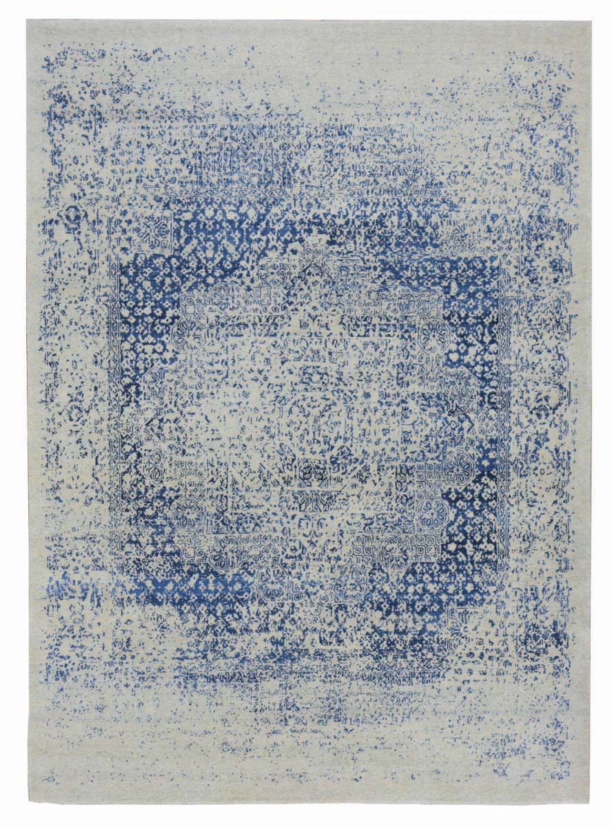 Montage of colourful pattered rugs, on white cover, The Handmade Carpet in bronze font on white centre square