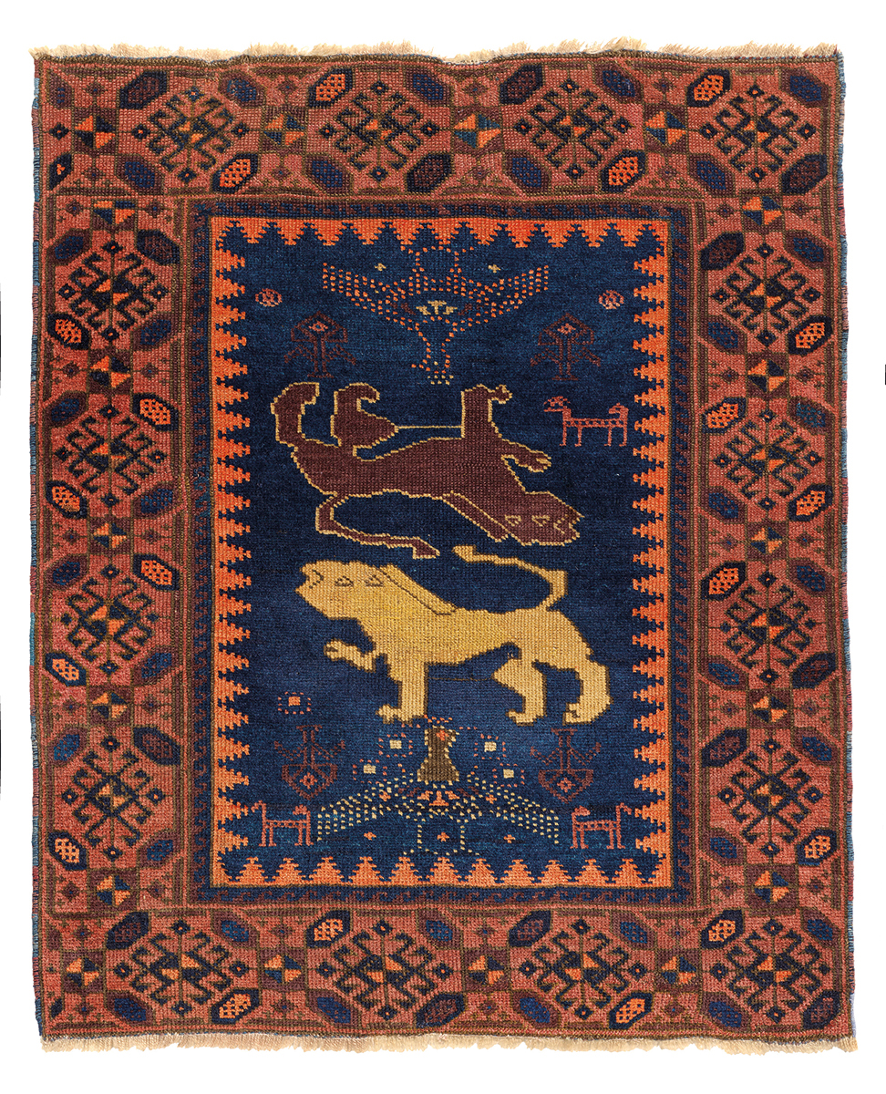 Orange rug with four animals and diamond patterns on cover of 'Nomadic Visions', by Hali Publications.