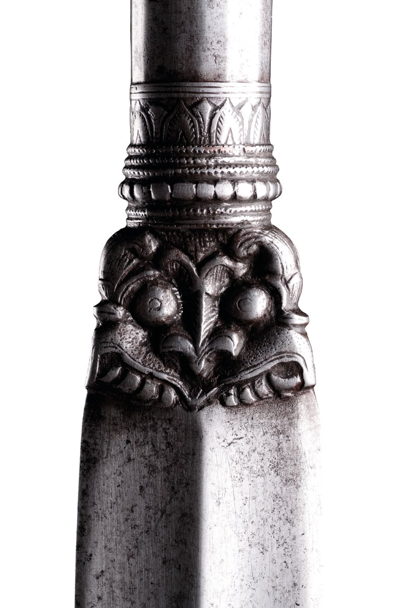 Gold outlines of Indian knives, swords, a shield and helmet, on black cover of 'Arms and Armour Of India, Nepal & Sri Lanka, Types, Decoration and Symbolism, by Hali Publications.
