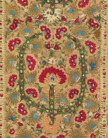 Vibrant Greek embroidery of figure wearing gold crown surrounded by flowers, on cover of 'Aegean Legacies, Greek Island Embroideries from the Ashmolean Museum', by Hali Publications.