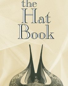 Book cover of The Hat Book with a horn-shaped hat covering a model's eyes. Published by Papadakis.