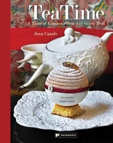 Book cover of Jean Cazals' TeaTime: A Taste of London's Best Afternoon Teas, with a tea cake dusted with icing sugar, and white teapot behind. Published by Papadakis.