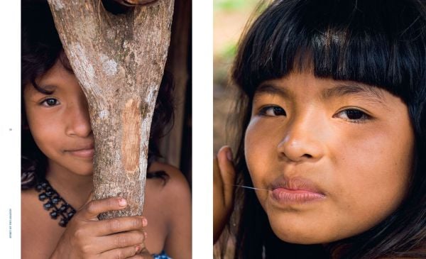 Book cover of Sue and Patrick Cunningham's Spirit of the Amazon: The Indigenous Tribes of the Xingu, featuring the eye of a tribesman with black tribal marks below. Published by Papadakis.