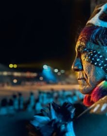 Book cover of Sue and Patrick Cunningham's Spirit of the Amazon: The Indigenous Tribes of the Xingu, featuring the eye of a tribesman with black tribal marks below. Published by Papadakis.