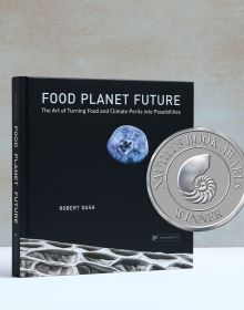 Book cover of Food Planet Future: The Art of Turning Food and Climate Perils Into Possibilities, with blueberry resembling the moon in a black sky. Published by Papadakis.