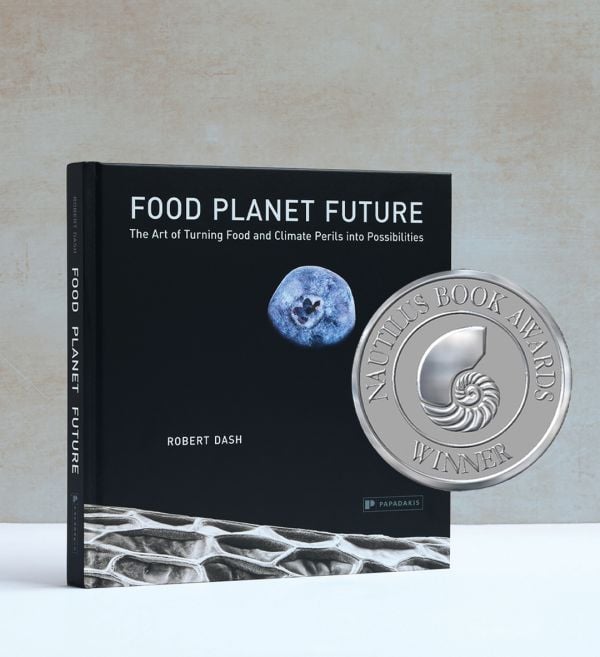 Book cover of Food Planet Future: The Art of Turning Food and Climate Perils Into Possibilities, with blueberry resembling the moon in a black sky. Published by Papadakis.