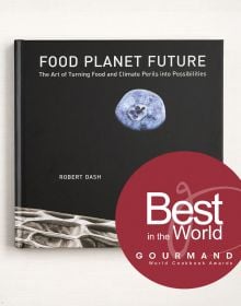Book cover of Food Planet Future: The Art of Turning Food and Climate Perils Into Possibilities, with blueberry resembling the moon in a black sky. Published by Papadakis.