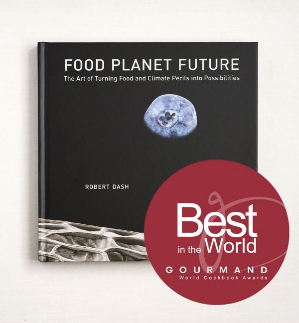 Book cover of Food Planet Future: The Art of Turning Food and Climate Perils Into Possibilities, with blueberry resembling the moon in a black sky. Published by Papadakis.