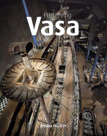 Book cover of Emma Hocker's Preserving Vasa, with an aerial view of a wooden ship in a museum. Published by Archetype Publications.