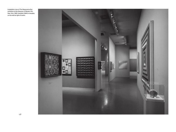 Bridget Riley sitting on a table, 'Bridget Riley: A Very Very Person', in white, and pink font to left side, by Ridinghouse.